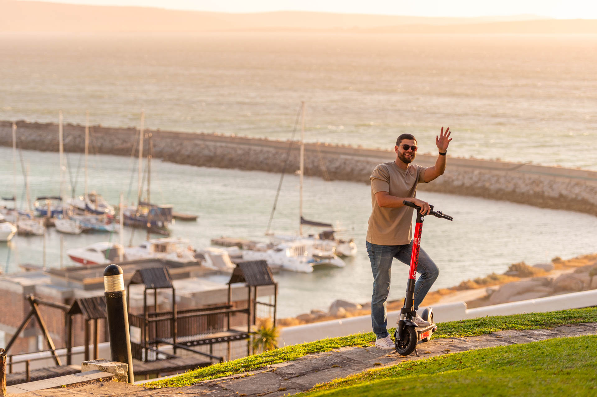 Man waving from Zippy scooter